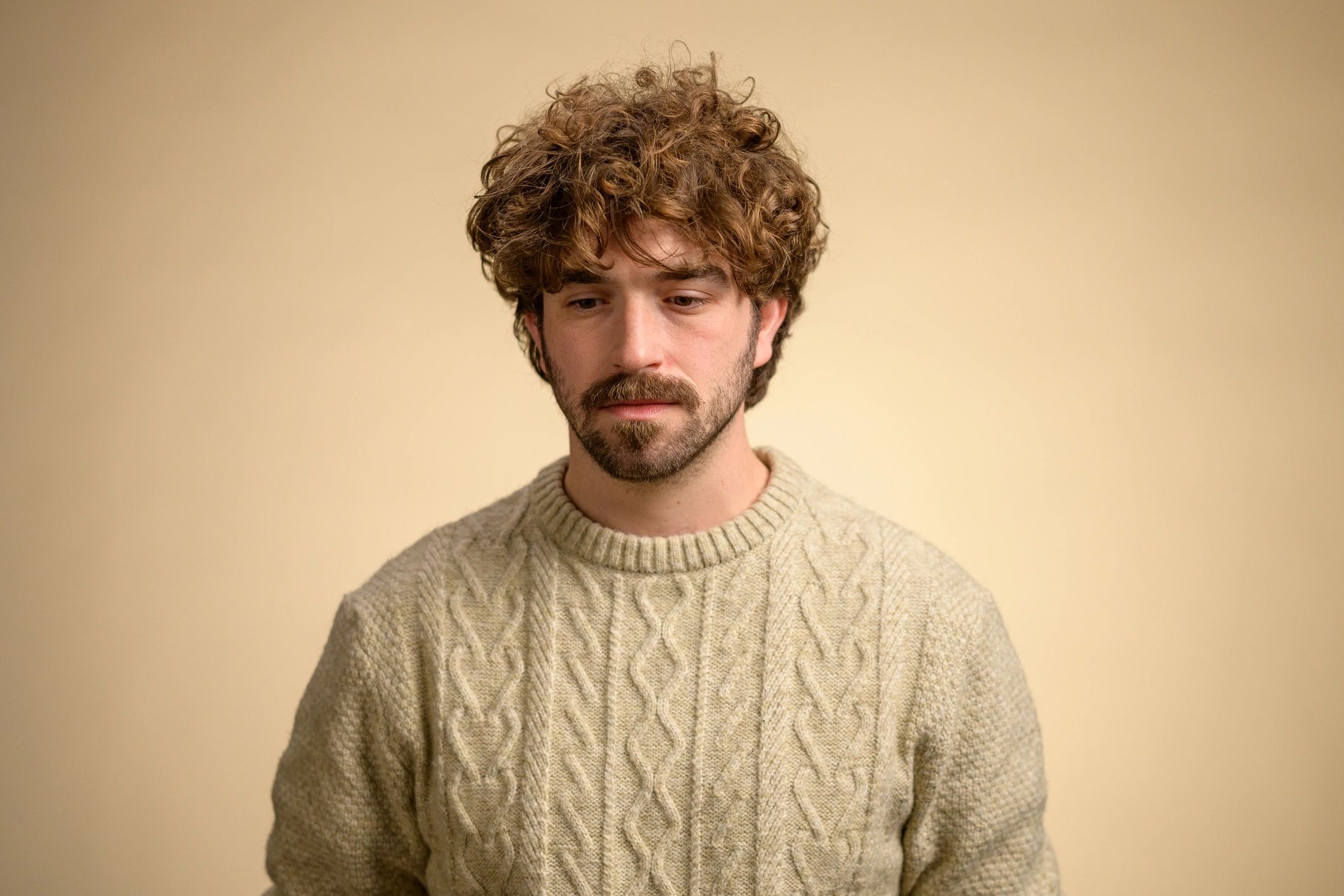 Minimalist studio portrait of a disciplined man